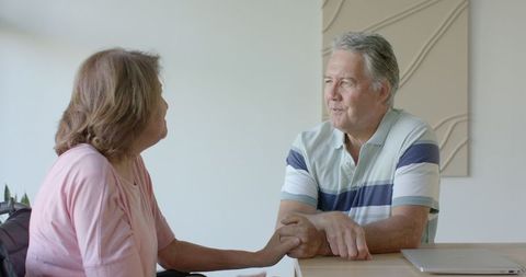 Senior Couple Engaging in Heartfelt, Bonding Moment at Home