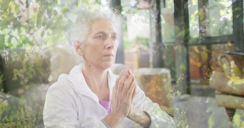 Senior Woman Meditating with Natural Overlay