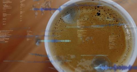 Top-down ceramic espresso cup showing crema with blue holographic waveform overlay