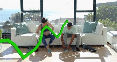 Couple tying sneakers before home workout with ocean view and fitness data overlay