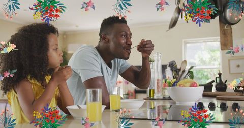 Father and Daughter Enjoying Breakfast with Floral Accents