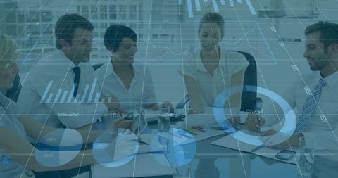 Collaborative business team analyzing data visualization and charts in modern boardroom