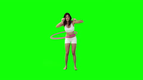 Woman Exercising with Hula Hoop on Green Background