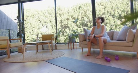 African American Woman Exercising at Home with Natural Light