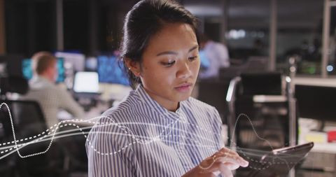 Asian Businesswoman Analyzing Data on Tablet in Office - Download Free Stock Images Pikwizard.com