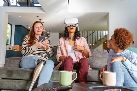 Diverse Friends Enjoying VR and Technology Together at Home