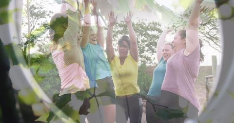 Diverse Women Enjoying Outdoor Fitness with Green Leaves Overlay