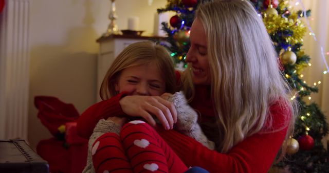 Mother Hugging Daughter During Christmas Celebration - Download Free Stock Images Pikwizard.com