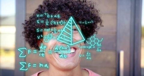 Smiling man wearing pink top displaying holographic math equations, pyramid and molecular diagram