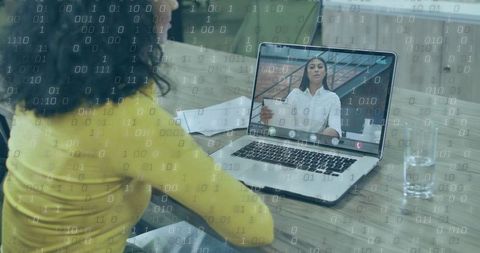 Joining remote video meeting at desk with laptop and binary overlay for data collaboration
