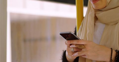 Asian Woman in Hijab Using Smartphone for Communication - Download Free Stock Images Pikwizard.com