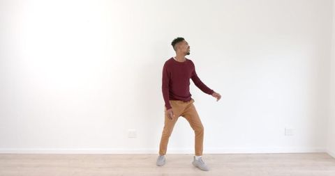 Casual Man Dancing in Modern Minimalist Room - Download Free Stock Images Pikwizard.com