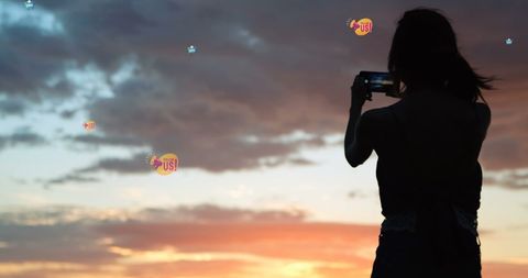 Silhouette of Woman Capturing Sunset with Smartphone and Social Media Icons - Download Free Stock Images Pikwizard.com