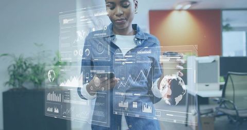 Woman Analyzing Digital Dashboards in Modern Office