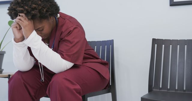 Stressed Medical Professional Taking a Break in Hospital Waiting Area - Download Free Stock Images Pikwizard.com