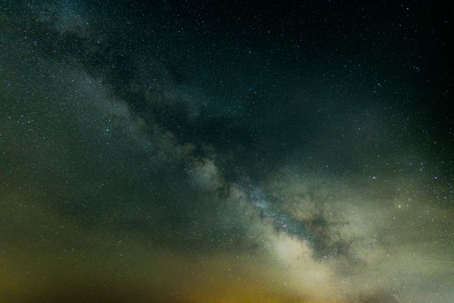This image showcases the breathtaking view of the Milky Way Galaxy and the stars scattered across the night sky. Ideal for use in astronomy, space exploration, and astrophotography-related content, this visually captivating shot highlights the beauty and vastness of the cosmos. Use in educational materials, science blogs, and social media posts to illustrate concepts related to astronomy and space.