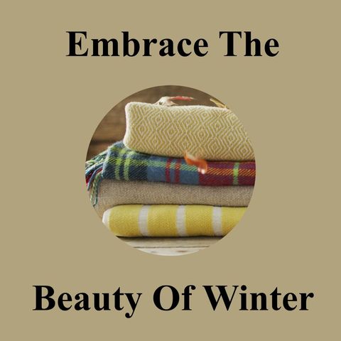 Stack of cozy blankets and seasonal text