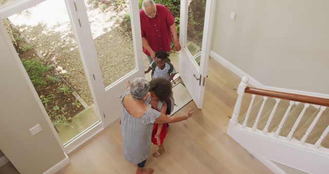 Grandparents Welcoming Grandchildren into House Entrance - Download Free Stock Images Pikwizard.com