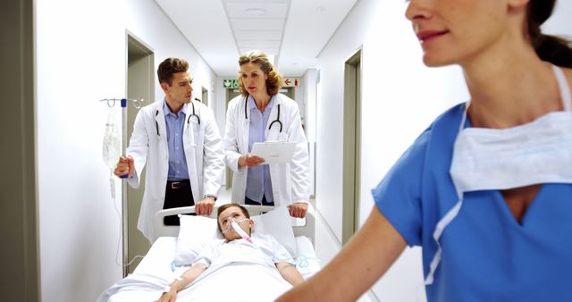 Healthcare team attentively transports a young female patient in a hospital setting. - Download Free Stock Photos Pikwizard.com