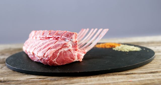 Raw Lamb Rack with Assorted Spices on Black Slate - Download Free Stock Images Pikwizard.com