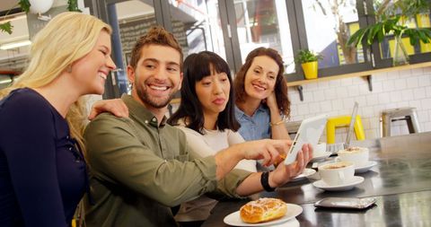 Friends Enjoying Cafe Conversation Looking at Smartphone - Download Free Stock Images Pikwizard.com