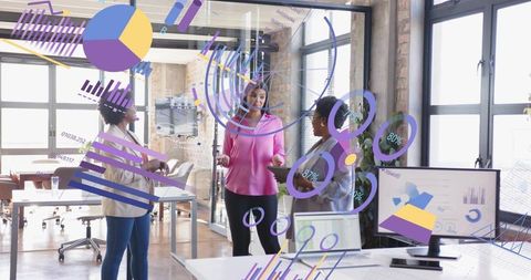 Businesswomen Discussing Data Trends with Collaborative Technology Interface