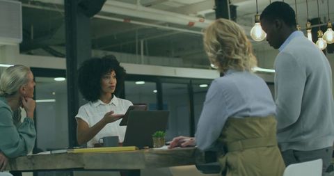 Team Collaborating at Modern Open-Plan Office Meeting