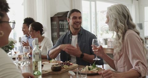 Friends Sharing Joyful Moments at Elegant Wedding Reception