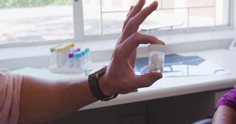 Doctor discussing treatment methods with senior during pandemic