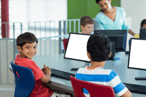 schoolboy smiling in computer classroom with transparent background - Download Free Stock Videos Pikwizard.com