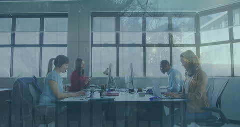 Diverse Business Team Working in Modern Office with Data Overlay