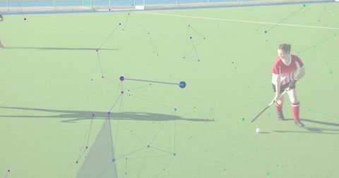 Field hockey player controlling ball on green turf with abstract digital network overlay