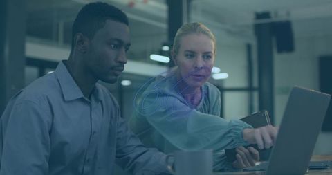 Team collaboration in modern office setting with technology