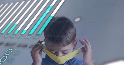 Young boy lowering yellow face mask with teal bar chart overlay illustrating health trend