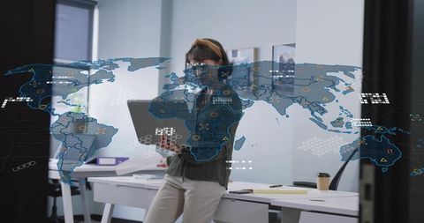 Businesswoman using laptop and phone with digital global map overlay for data analytics