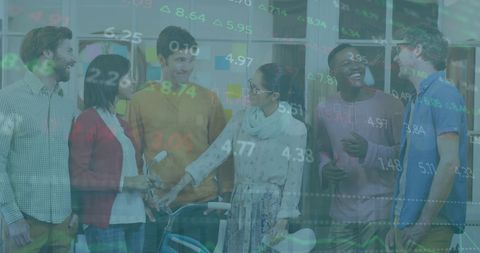 Diverse colleagues smiling in office with financial data overlay