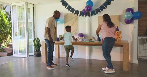 Diverse Family Joyfully Celebrating Birthday at Home