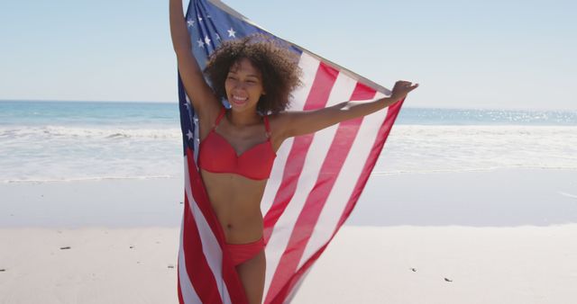 Young Woman Holding American Flag at Beach Celebrating - Download Free Stock Images Pikwizard.com