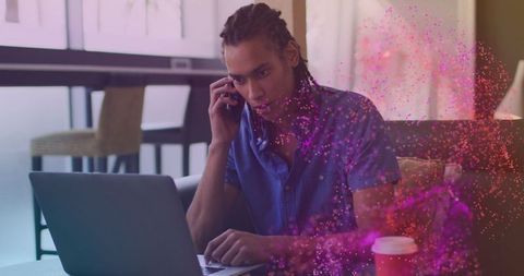 Businessman Engaging in Phone Call with Laptop and Virtual Overlay