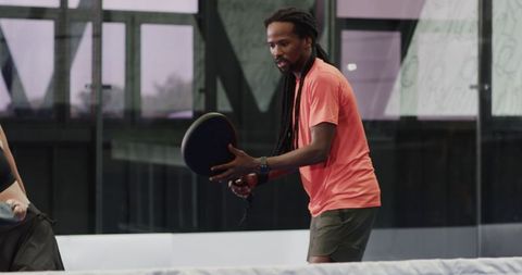 Man Playing Padel Tennis Focusing on Accurate Paddle Hit