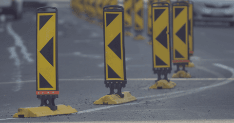 traffic bollards creating safety and order on urban road - Download Free Stock Videos Pikwizard.com