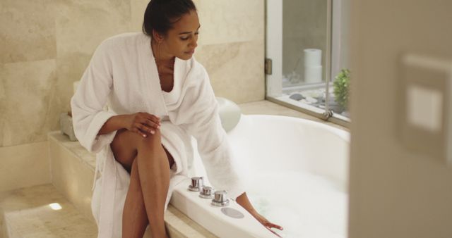 Elegant Woman in Bathrobe Preparing a Bath - Download Free Stock Images Pikwizard.com