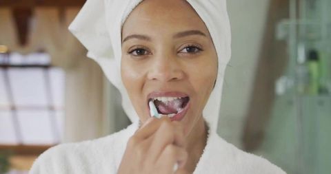 Woman Practicing Morning Dental Hygiene at Home