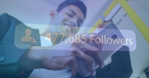 smiling young man viewing social media follower count on smartphone - Download Free Stock Images Pikwizard.com
