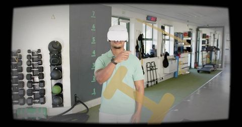 Man navigating virtual reality fitness training wearing white vr headset in gym