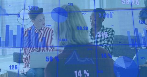 Diverse team collaborating and analyzing digital business data with charts and laptops