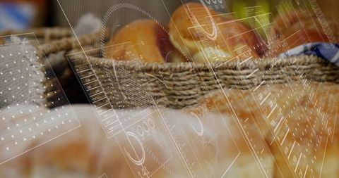 Woven bakery basket holding golden rolls blending with translucent hud overlay retail tech