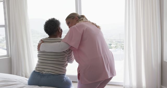 Nurse Comforting Senior Woman in Bright Room - Download Free Stock Images Pikwizard.com