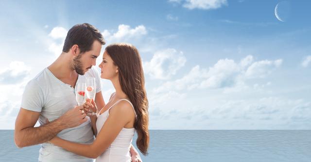 Digital composite of Loving couple having champagne at beach