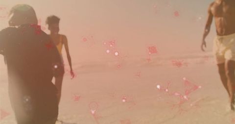 Carefree Walk on Sunlit Beach Enveloped by Dazzling Pink Sparkles